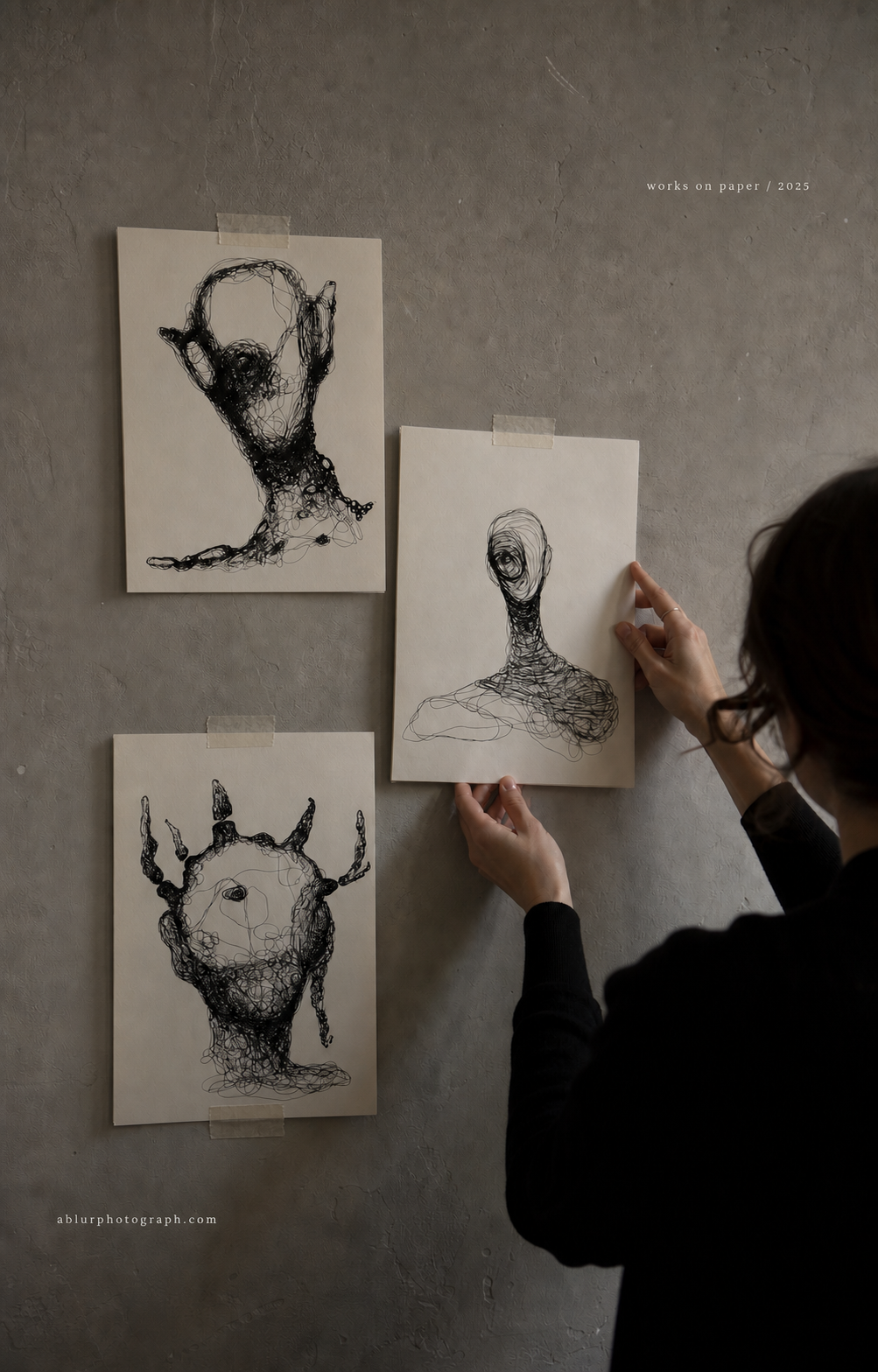 Loose original works on paper arranged for viewing